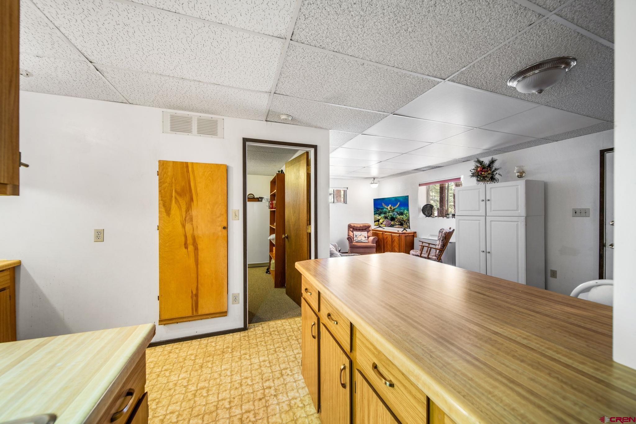 900 Spring Road Durango, CO 81303 - Photo 20 of 33 a living room with stainless steel appliances kitchen island granite countertop furniture and a kitchen view