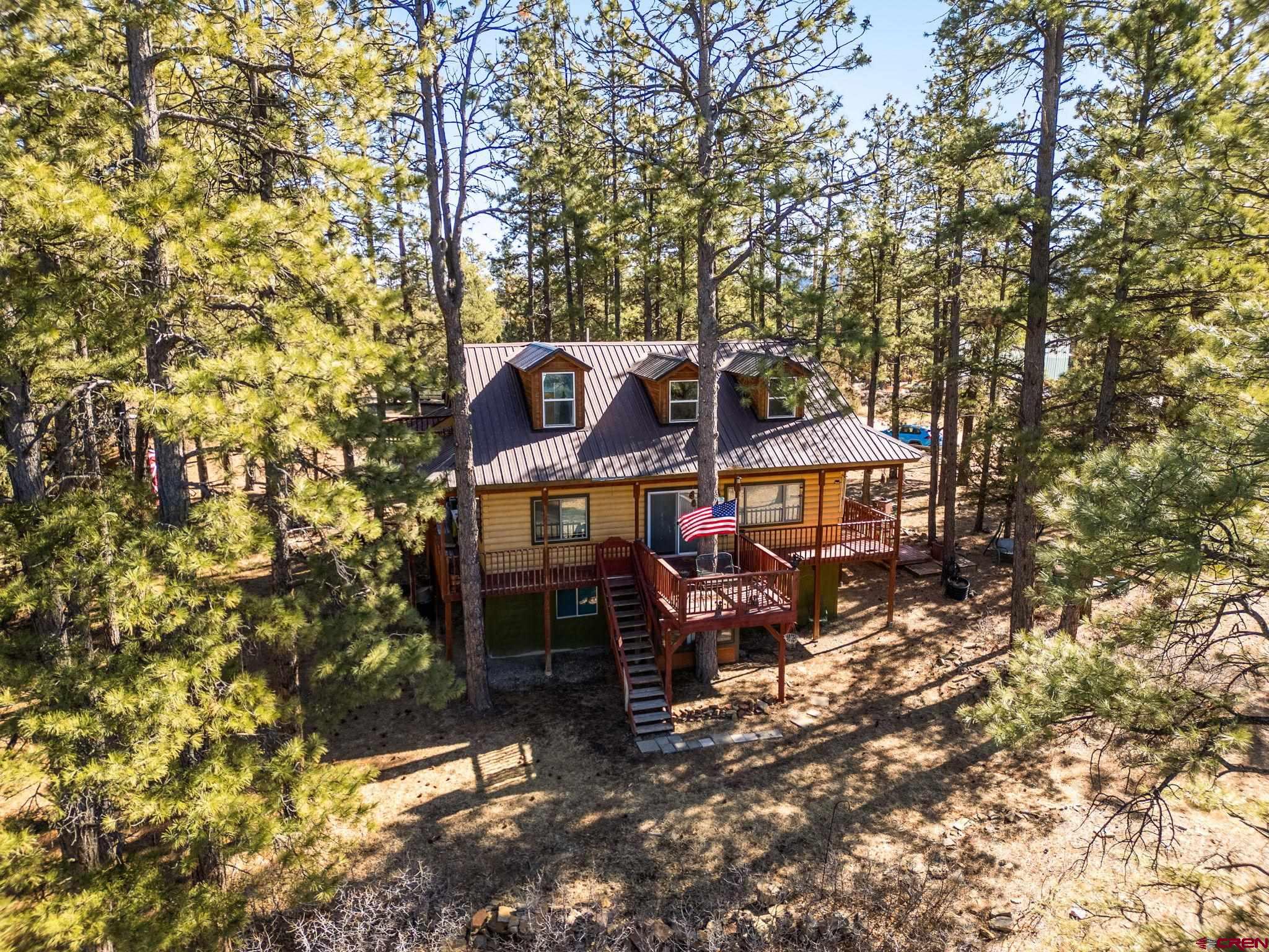900 Spring Road Durango, CO 81303 - Photo 25 of 33 a view of a house with a yard