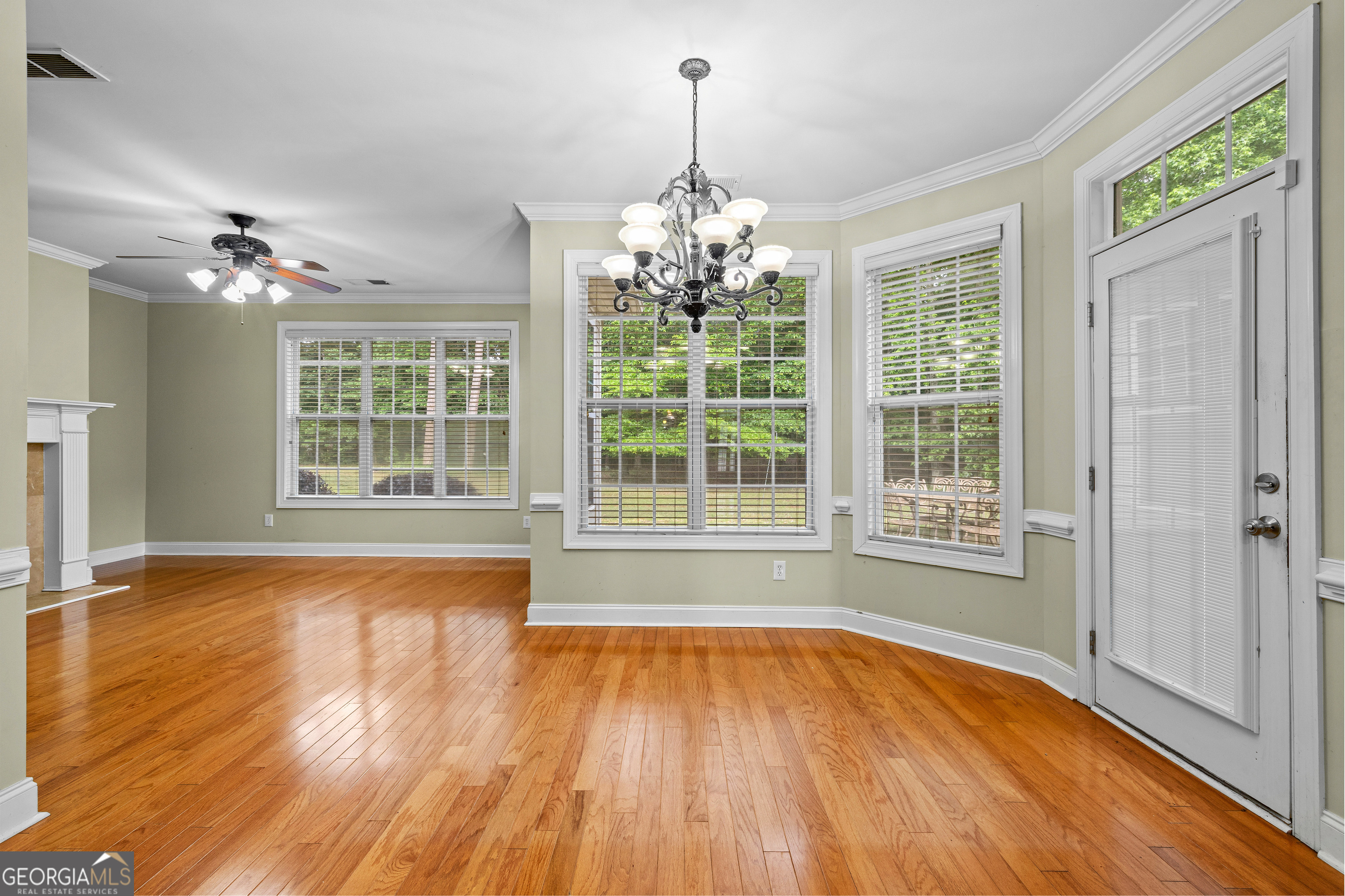 120 Shankhill Ridge Tyrone, GA 30290 - Photo 18 of 54 a view of an empty room with wooden floor and a window