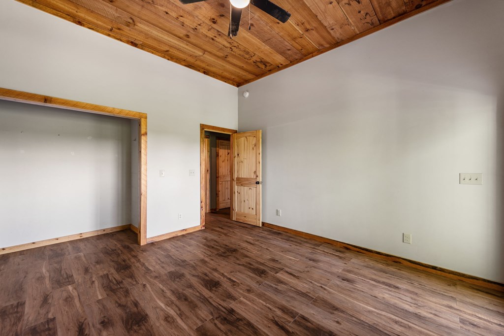 479 Big Timber Road Mineral Bluff, GA 30559 - Photo 38 of 60 a view of an empty room with wooden floor