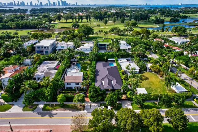 a bathroom with a sink toilet vanity and shower