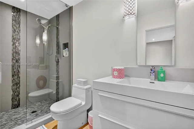 a utility room with a refrigerator and washer