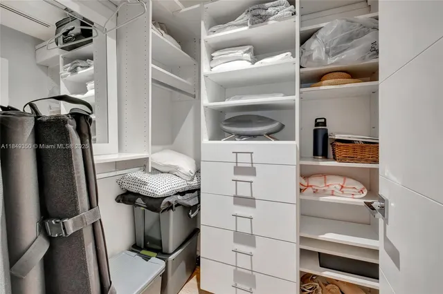 a room with a walk in closet and a window