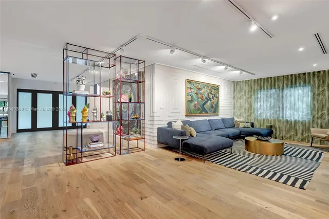 a living room with furniture or couch and a large window