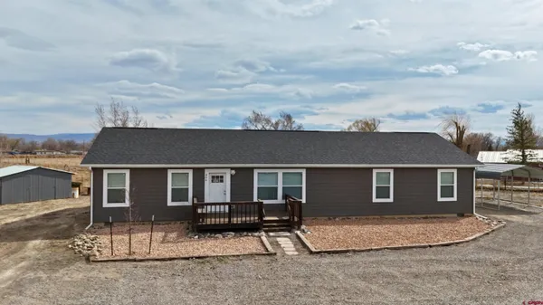 front view of a house with a barbeque