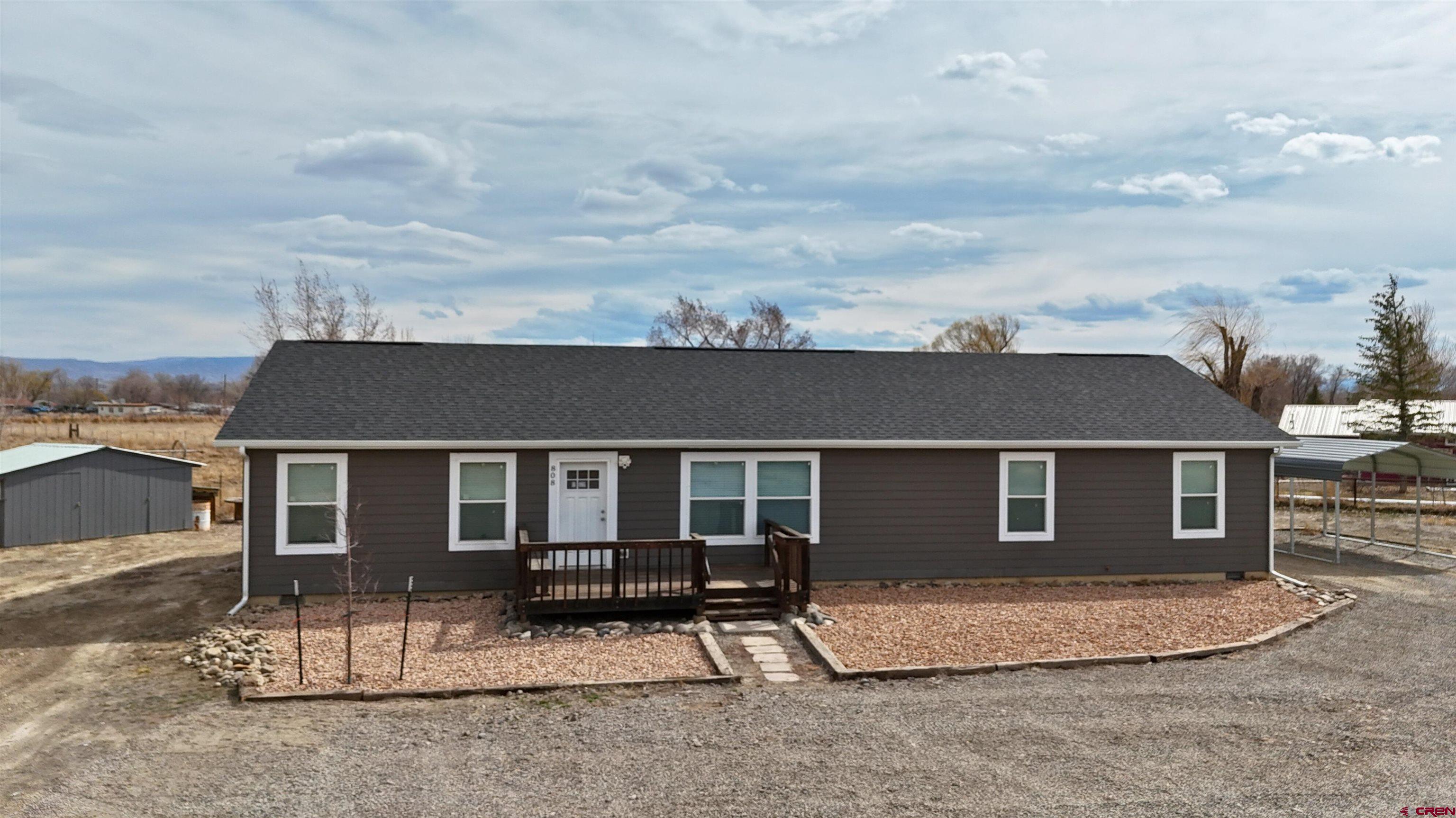 front view of a house with a barbeque