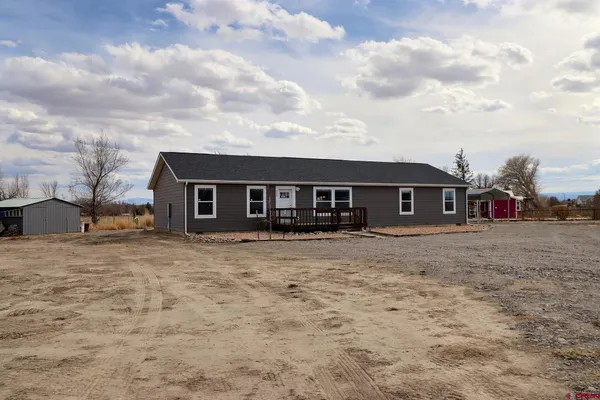 front view of a house with a dry yard