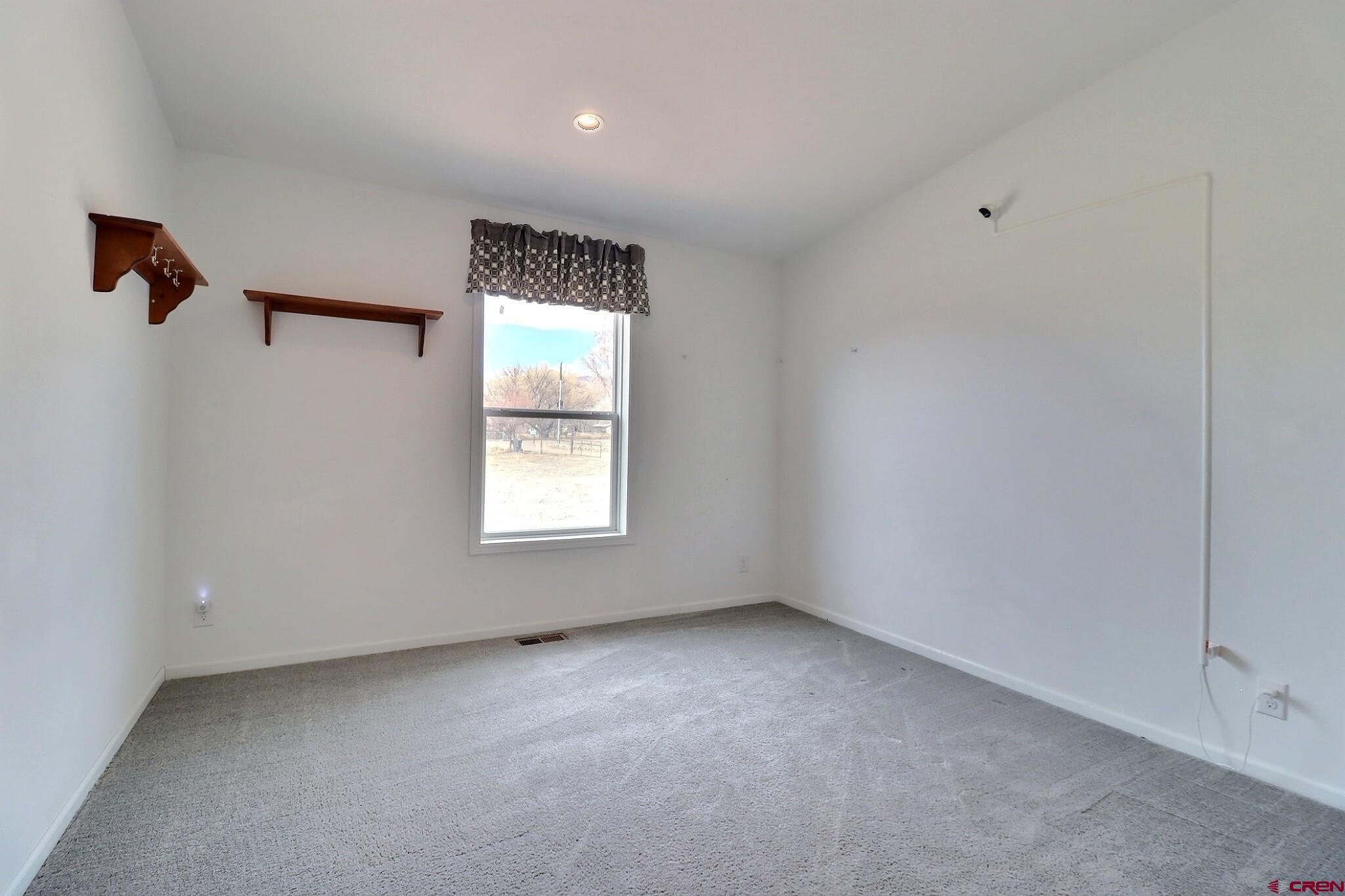 808 1525th Road Delta, CO 81416 - Photo 29 of 43 a view of an empty room with a window