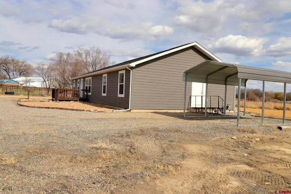 a view of a house with a snow in the yard