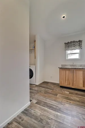 a view of entryway with wooden floor