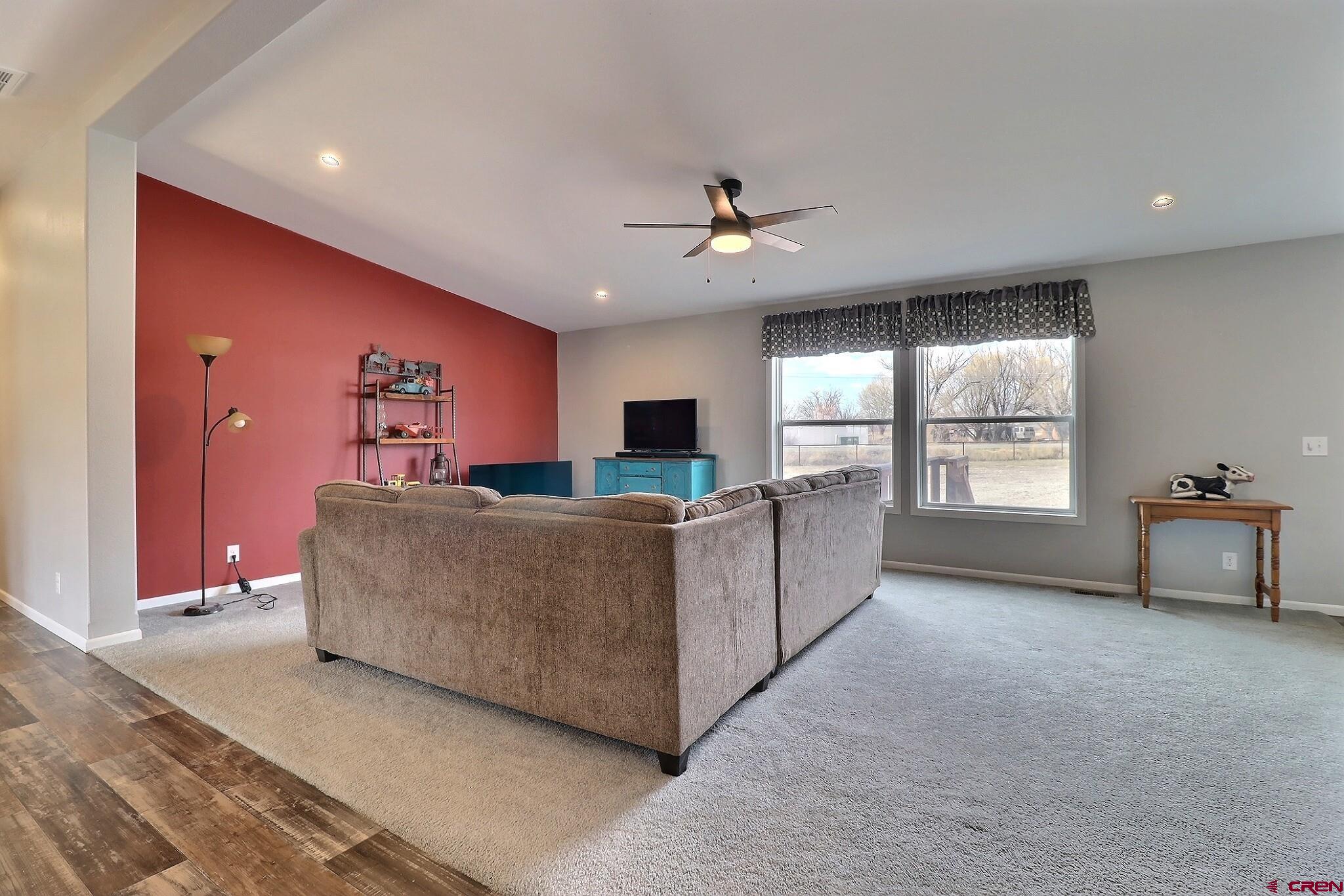 808 1525th Road Delta, CO 81416 - Photo 7 of 43 a living room with furniture and a flat screen tv
