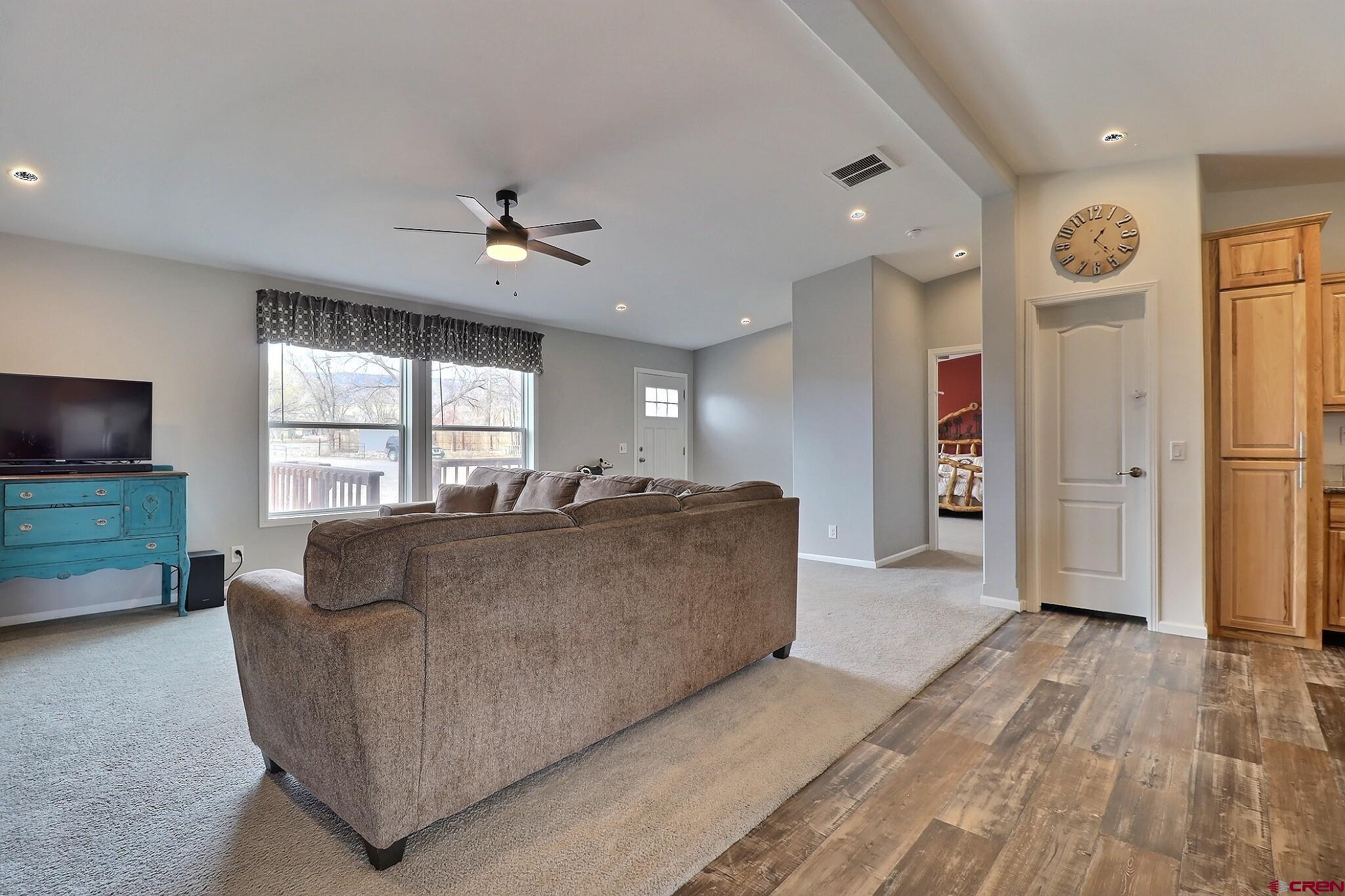 808 1525th Road Delta, CO 81416 - Photo 8 of 43 a living room with furniture and a flat screen tv