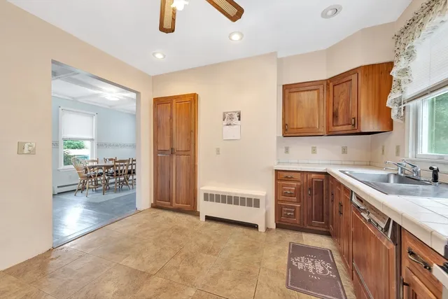 a kitchen with stainless steel appliances granite countertop a sink and cabinets
