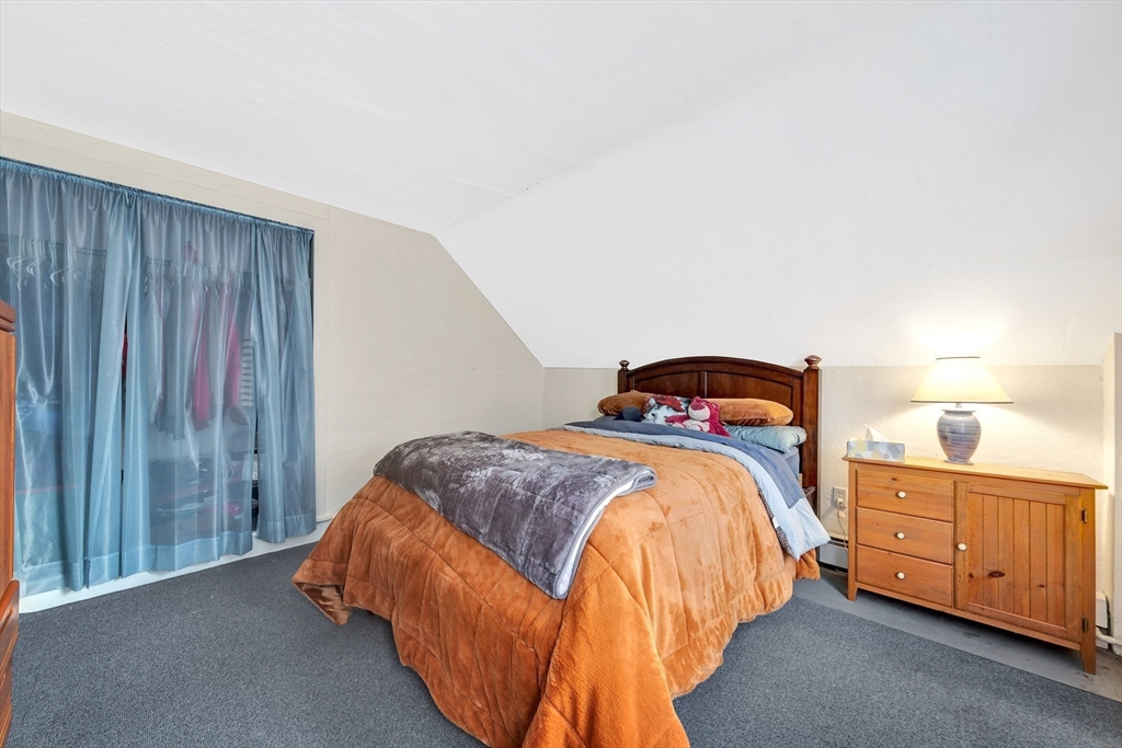 72 Hillside Avenue Lynn, MA 01902 - Photo 19 of 36 a bedroom with a bed and a cabinets