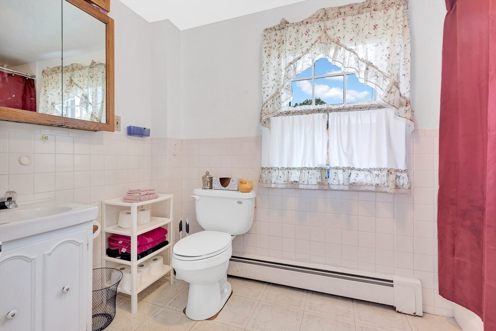 72 Hillside Avenue Lynn, MA 01902 - Photo 23 of 36 a bathroom with a sink and a toilet