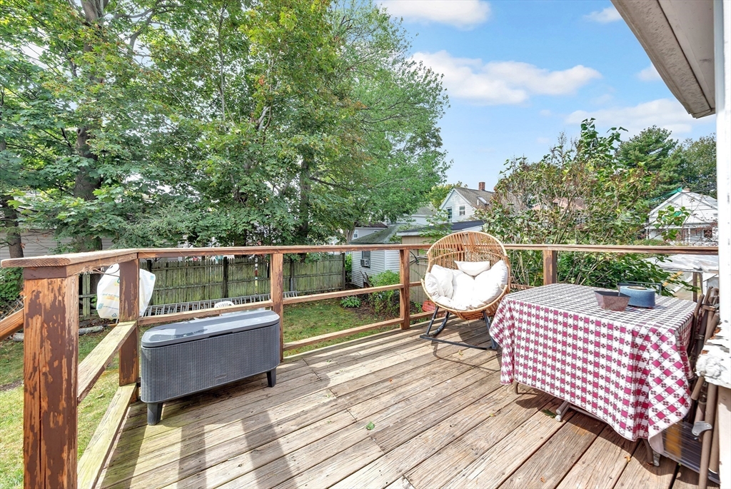 72 Hillside Avenue Lynn, MA 01902 - Photo 27 of 36 a balcony with wooden floor table and chairs