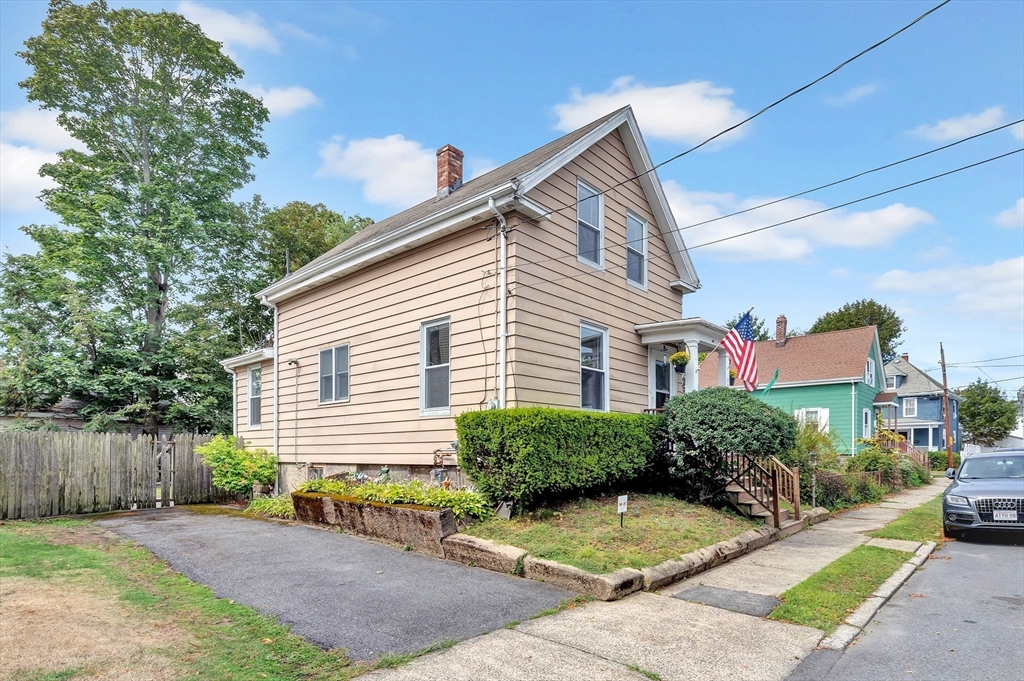 72 Hillside Avenue Lynn, MA 01902 - Photo 35 of 36 a view of a house with a yard and potted plants