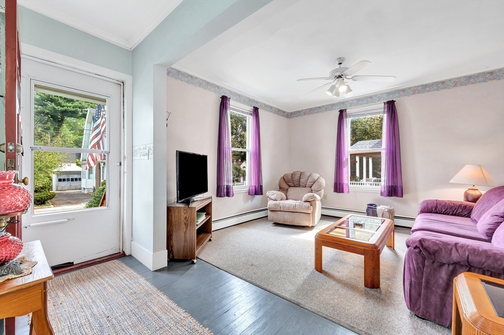 72 Hillside Avenue Lynn, MA 01902 - Photo 4 of 36 a living room with furniture and a flat screen tv