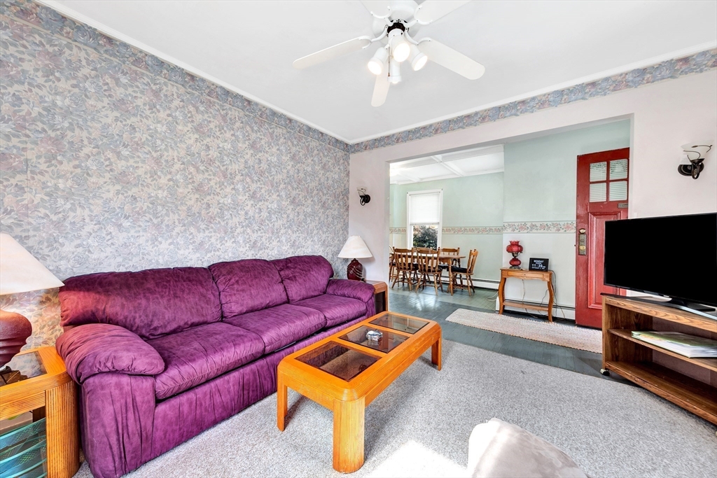 72 Hillside Avenue Lynn, MA 01902 - Photo 6 of 36 a living room with furniture and a flat screen tv