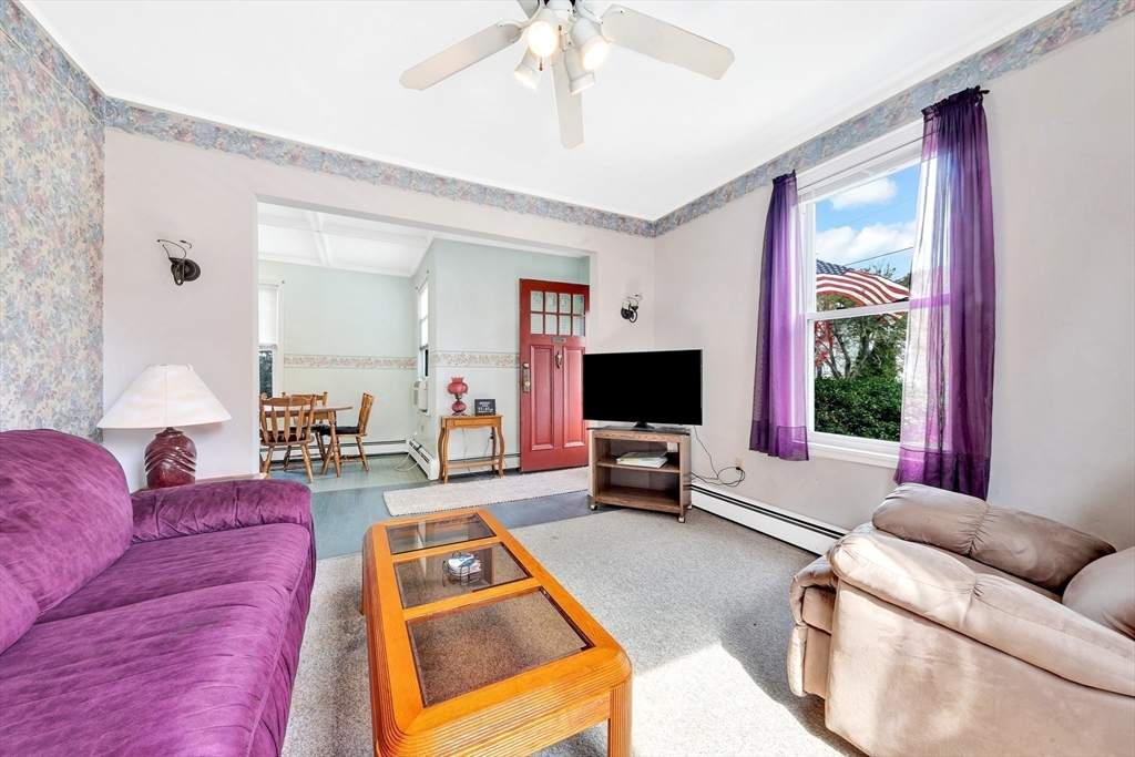 72 Hillside Avenue Lynn, MA 01902 - Photo 7 of 36 a living room with furniture and a flat screen tv