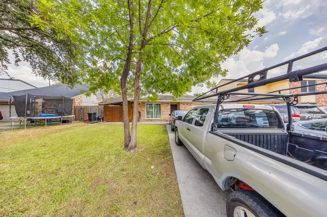 a view of house with swimming pool outdoor seating
