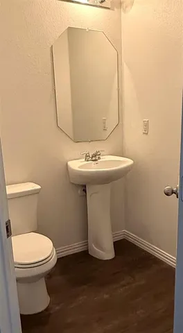 a bathroom with a sink and a toilet