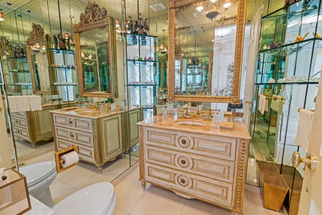 a bathroom with a sink mirror and a bath tub