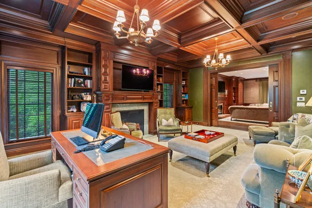 a living room with furniture a flat screen tv and a dining table