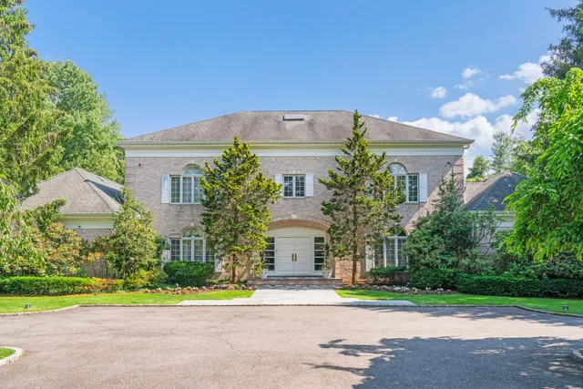 a view of street along with house and trees