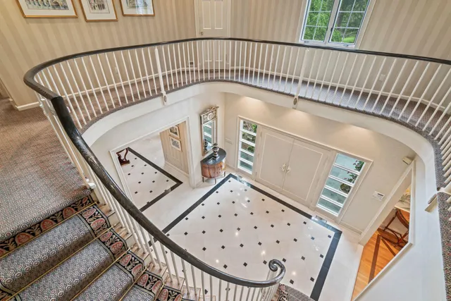 a view of a balcony with furniture