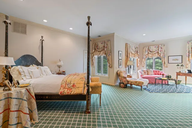 a bedroom with double bed and a window