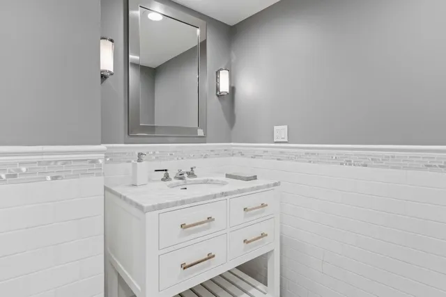 a aerial view of a house with swimming pool and garden