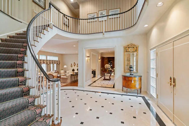 a view of entryway livingroom and hall with wooden floor