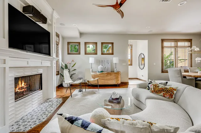 a living room with furniture fireplace and flat screen tv