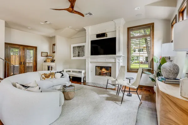 a living room with furniture fireplace and a flat screen tv