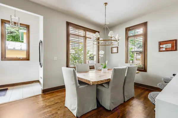 a view of a dining room with furniture window and wooden floor