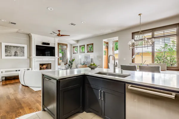 a kitchen with a sink appliances and a counter top space