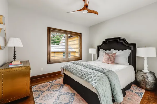 a bedroom with bed and a window