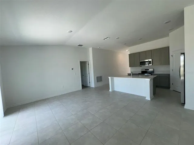 a view of a kitchen with a sink cabinets and a window