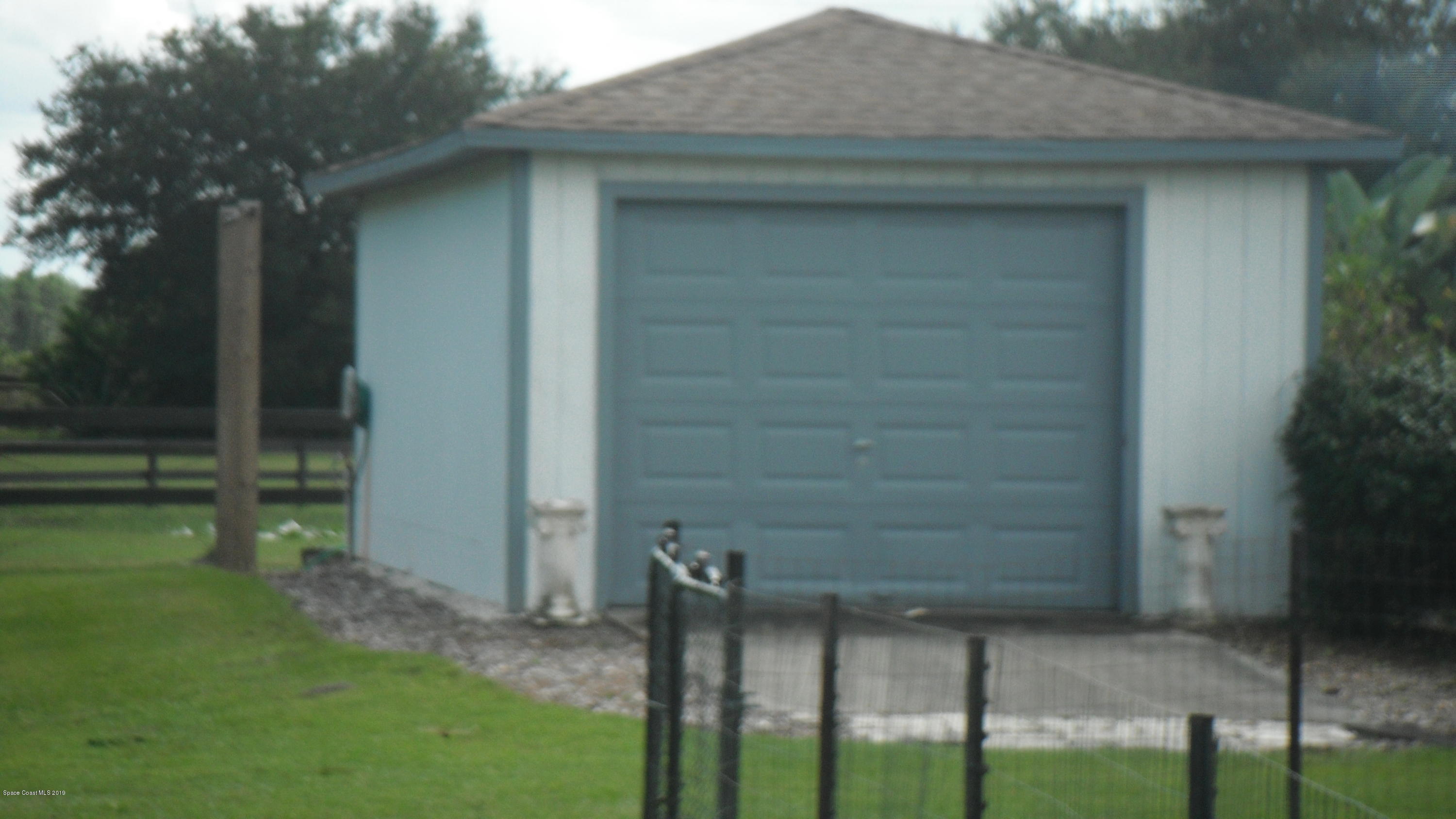 207 Deer Run Road Palm Bay, FL 32909 - Photo 31 of 36 Rear Detached Garage