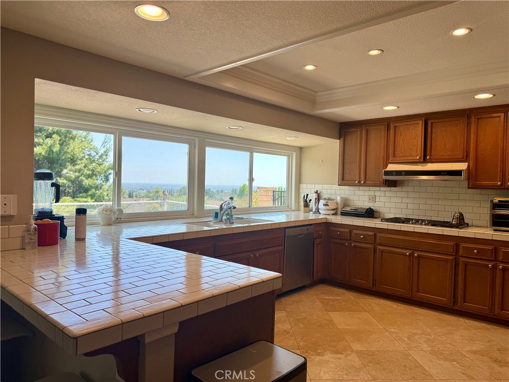 1364 Armstead Lane Fullerton, CA 92833 - Photo 11 of 21 a kitchen with granite countertop sink stove and cabinets