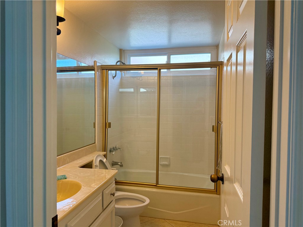 1364 Armstead Lane Fullerton, CA 92833 - Photo 17 of 21 a bathroom with a granite countertop bathtub shower sink vanity and toilet