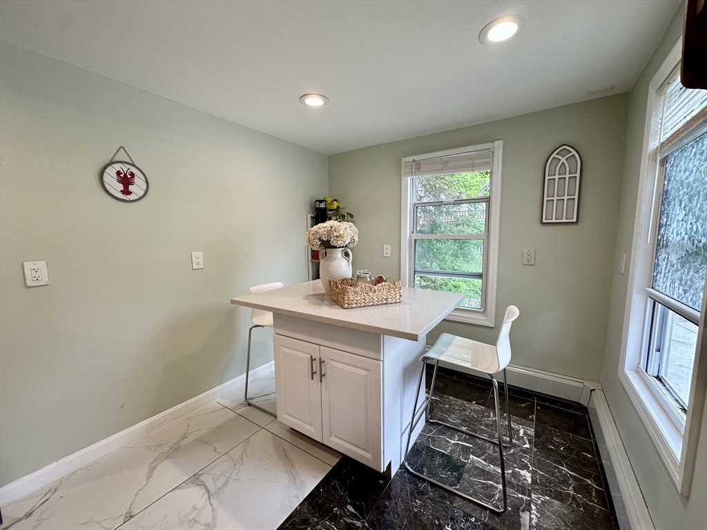 13 Mill Street Lancaster, MA 01523 - Photo 2 of 42 a room with a window and a table