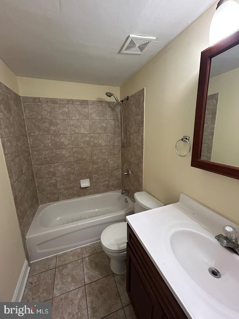 106 North Eutaw Street, Unit 3A Baltimore, MD 21201 - Photo 6 of 6 a bathroom with a sink a toilet and shower