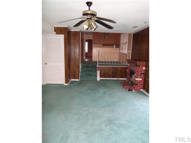 2613 Firelight Road Raleigh, NC 27610 - Photo 4 of 10 a view of a room with a ceiling fan and entryway
