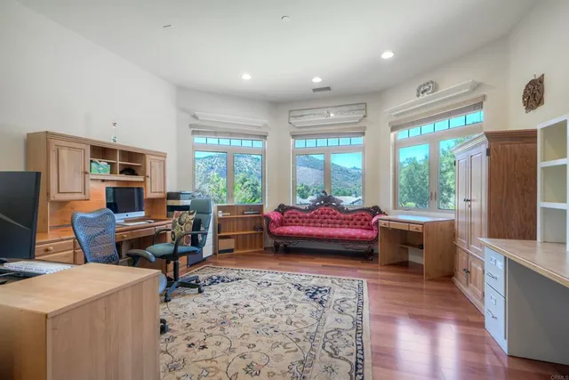 a kitchen with stainless steel appliances wooden cabinets and a stove top oven
