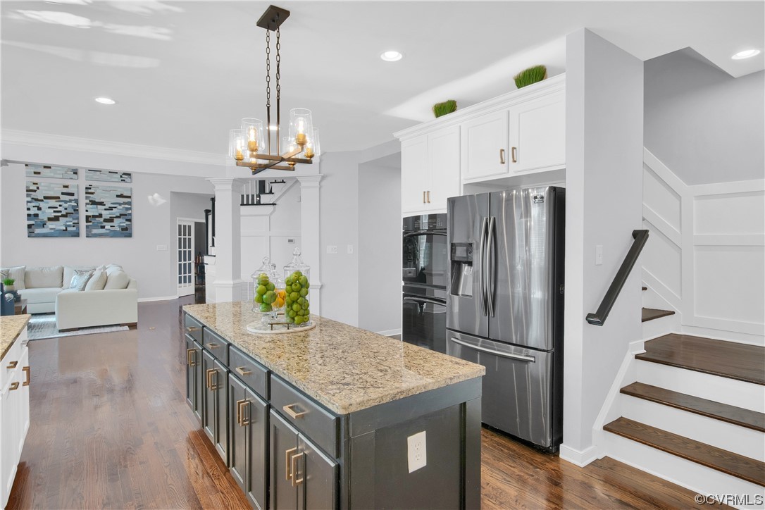 6418 Rivershook Terrace Moseley, VA 23120 - Photo 24 of 44 a kitchen with stainless steel appliances a dining table chairs and chandelier
