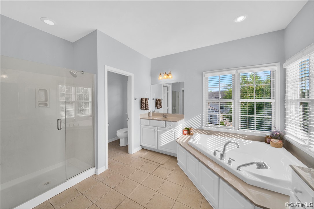 6418 Rivershook Terrace Moseley, VA 23120 - Photo 30 of 44 a spacious bathroom with a granite countertop tub mirror and double vanity