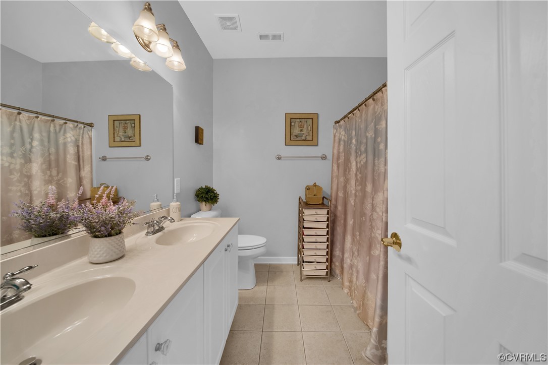 6418 Rivershook Terrace Moseley, VA 23120 - Photo 35 of 44 a bathroom with a sink a toilet and shower