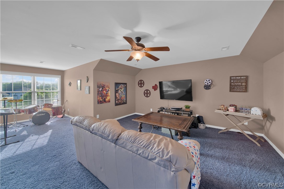 6418 Rivershook Terrace Moseley, VA 23120 - Photo 36 of 44 a living room with furniture and a flat screen tv